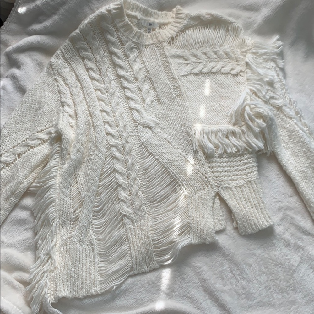 Cream colored distressed sweater